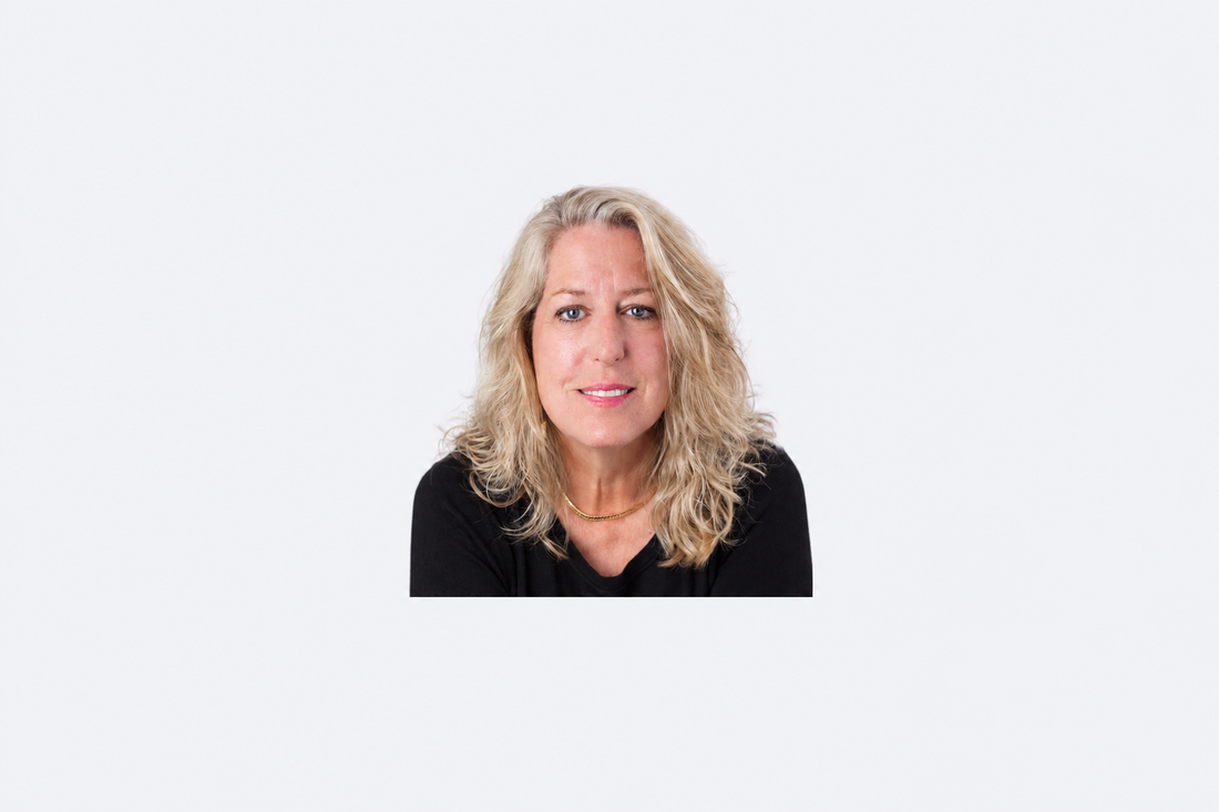 Portrait of author Reta Hampton centered on a padded light background.